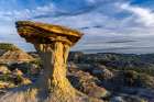 Caprock formation in the badlands of Makoshika State Park in Glendive, Montana, USA. Art Print